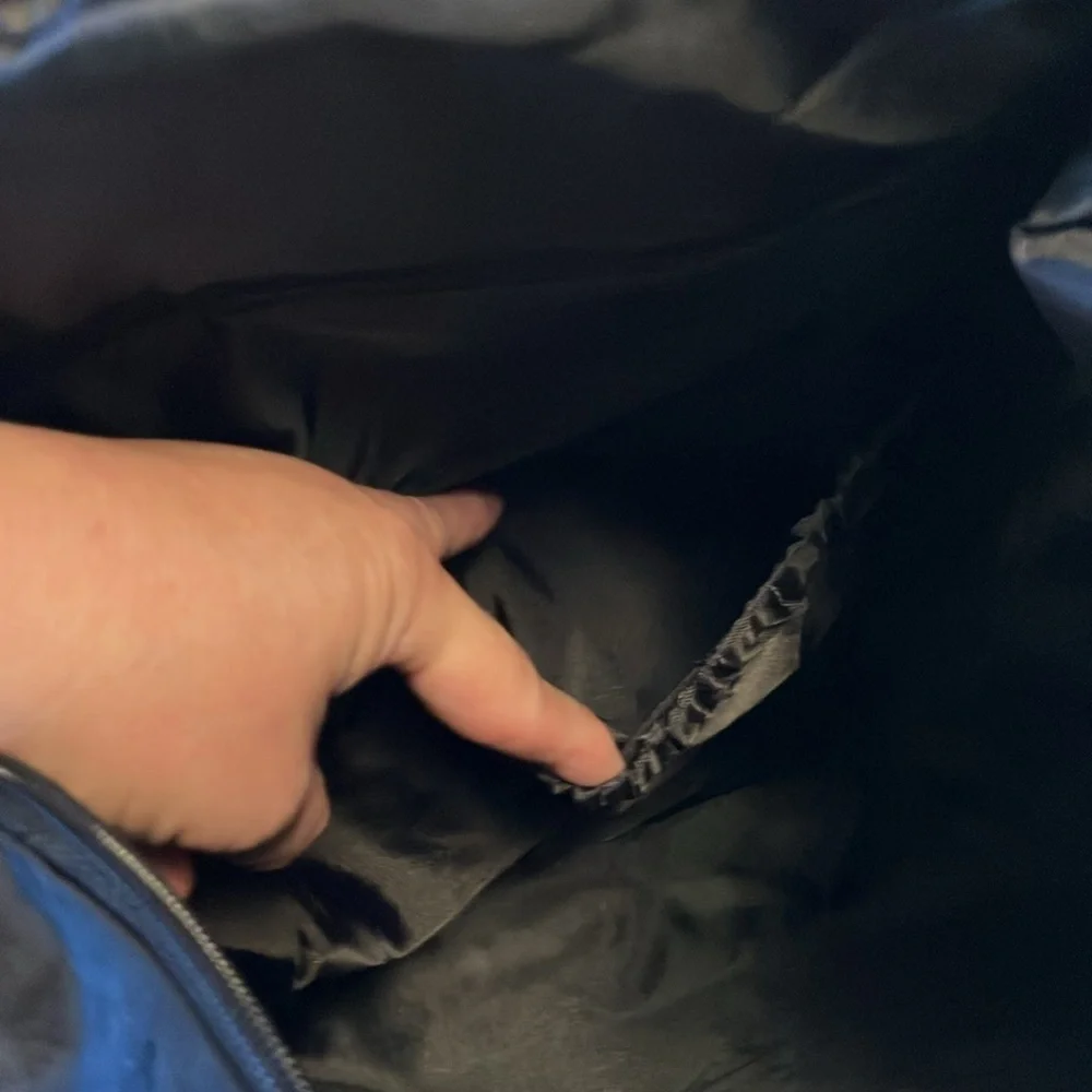 On the go backpack by Thirty-One. New in bag. Butterfly embroidered on flap